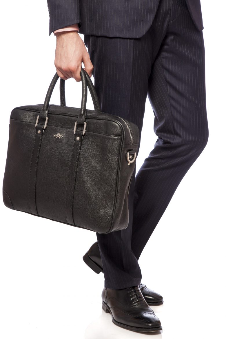 An english gentleman with a travel bag and cane Vector Image